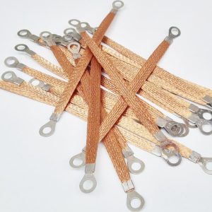 Bundle of flexible copper braided grounding jumper straps with ring lugs